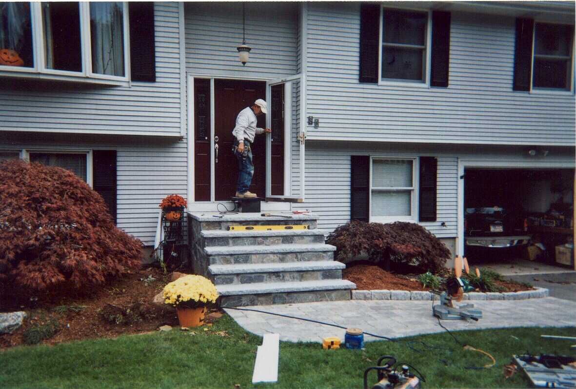Tall composite deck with privacy screen and stairs.  Also front entry door.