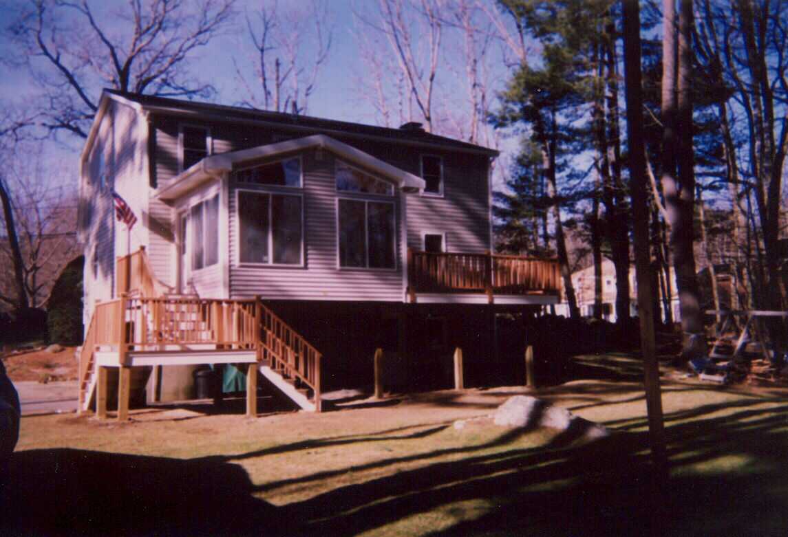 Three season room with mahogany deck and stairs