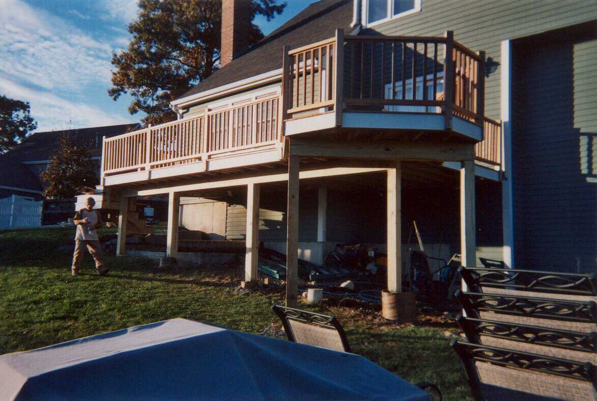 Beautiful mahogany with a bump, stair with turn and square Pressure Treated lattice below.